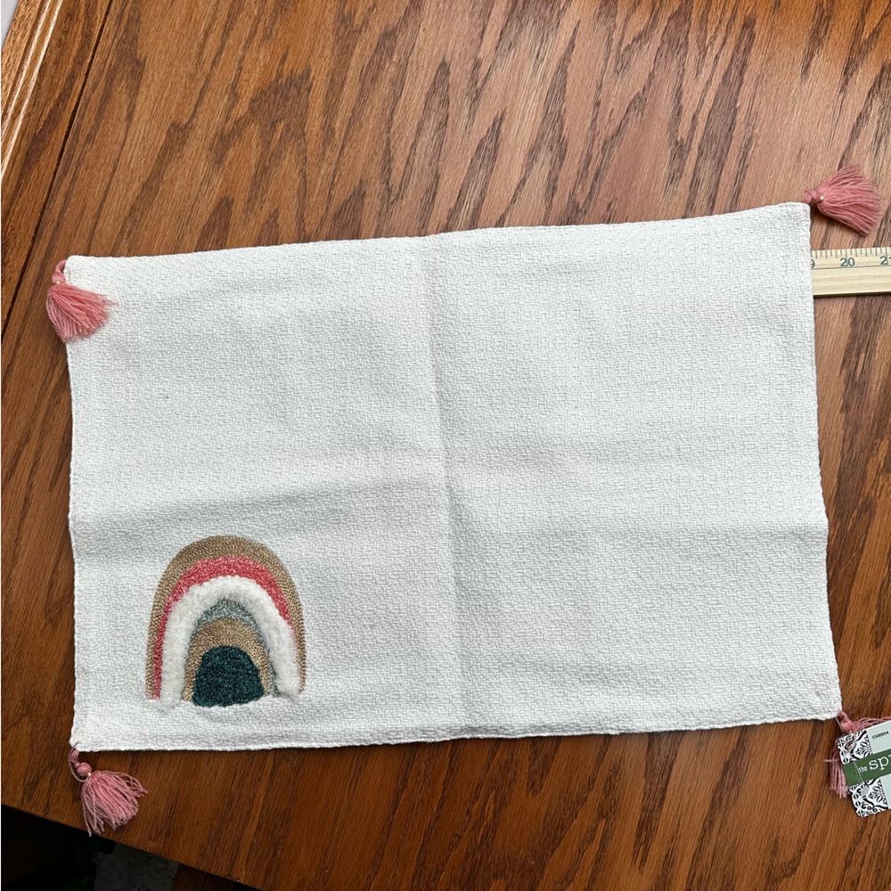 Muted rainbow embroidered placemat